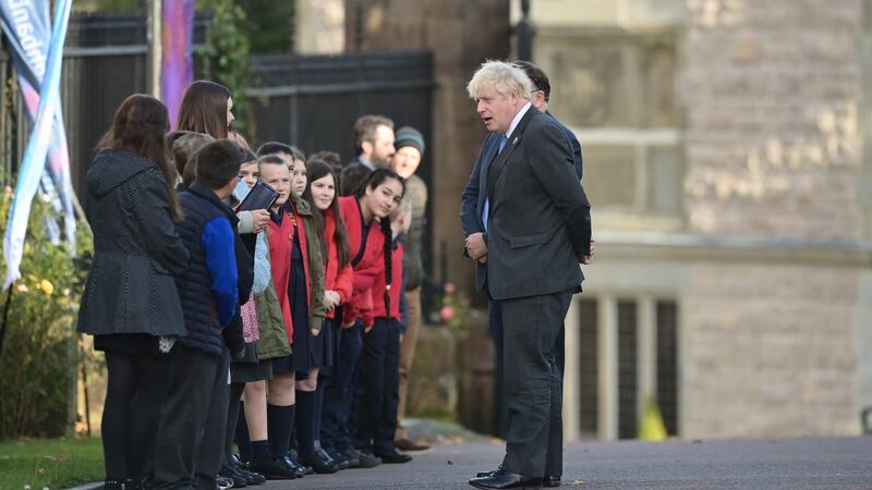 British prime minister, Boris Johnson is greeted by schoolchildren as he arrives at St Patrick’s Church of Ireland cathedral in Armagh. Photograph: Charles McQuillan/Getty Images