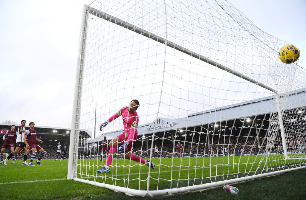 Raul Jimenez scores Fulham's first goal past West Ham goalkeeper Lukasz Fabianski during the Premier League match at Craven Cottage. Photograph: Mike Hewitt/Getty Images
