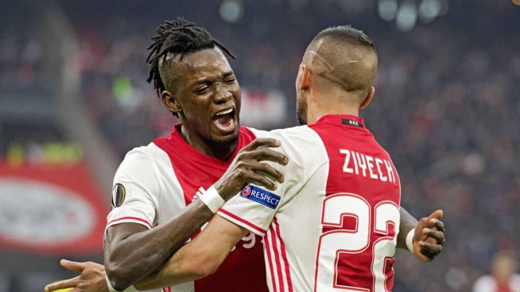 Ajax player Bertrand Traore celebrates with Hakim Ziyech after scoring his second and his side’s fourth goal in the Europa League semi-final first leg against lyon at the Amsterdam Arena. Photograph: Olaf Kraak/EPA