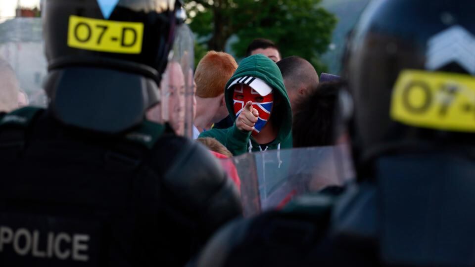 A loyalist protester gestures to the police in the Woodvale Road area of north Belfast last Sunday. Photograph: Cathal McNaughton/Reuters