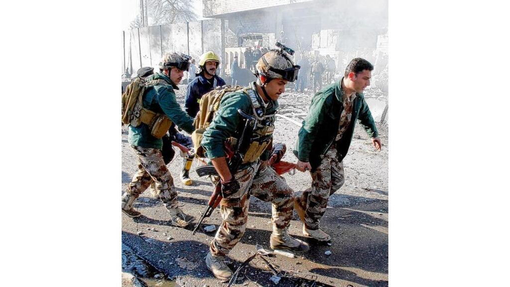 A casualty is carried by soldiers at the site of a suicide bomb attack in Kirkuk, 250km (155 miles) north of the capital, Baghdad. photograph: reuters
