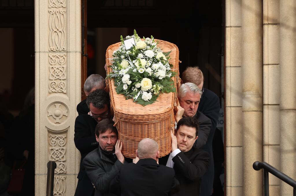 The coffin of journalist Brian Hutton is borne from St Patrick's Church in Derry following his funeral. Photograph: Liam McBurney/PA