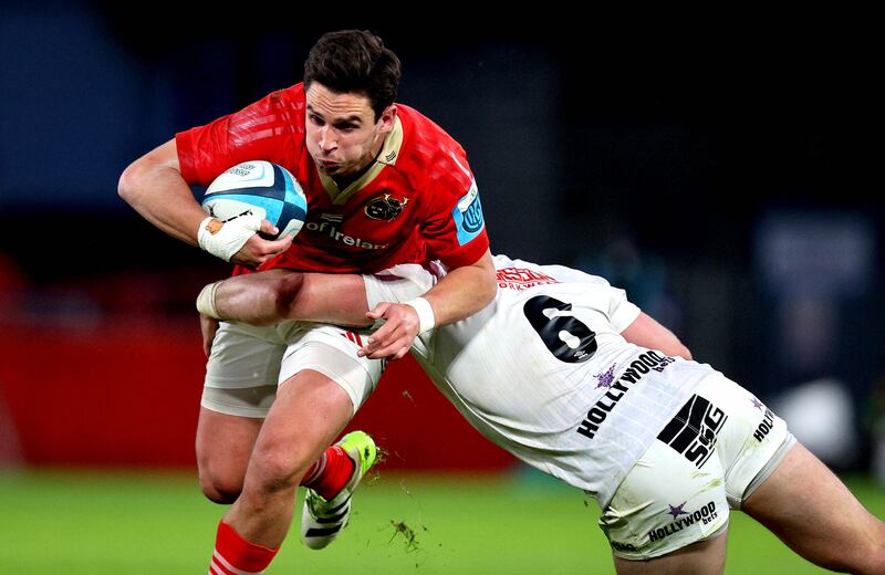 Munster’s Joey Carbery is tackled by James Venter of Sharks at Thomond Park. Photograph: Ryan Byrne/Inpho