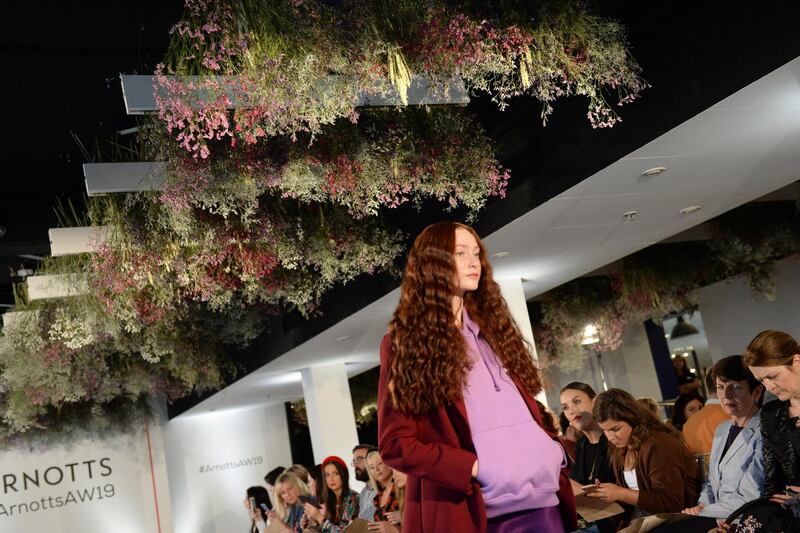 Arnotts AW2019: Emily wears a purple Tommy Jeans hoody, €100; purple Set silk slip skirt, €105; burgundy Tara Jarmon blazer, €320; and turquoise and purple Tommy Hilfiger chunky trainers, €155. Photograph: Dara Mac Dónaill