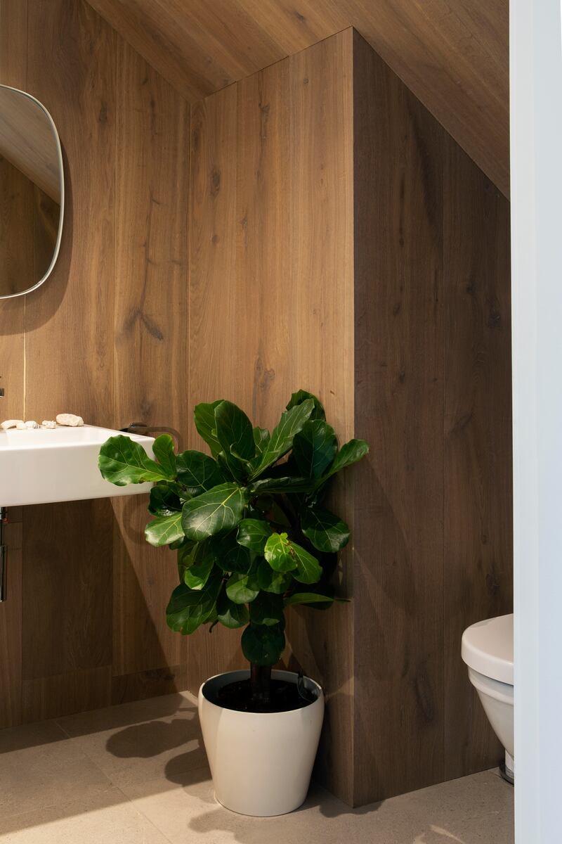 Timber-panelled guest WC by Optimise Design