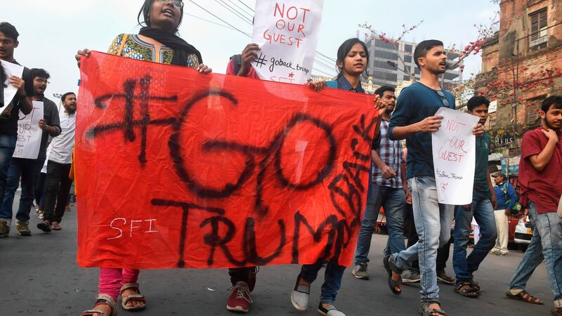 Leftist students activists shout slogans as they protest against the visit of US President Donald Trump to India, in Kolkata on Monday. Photograph: Dibyangshu Sarkar/AFP/Getty Images)
