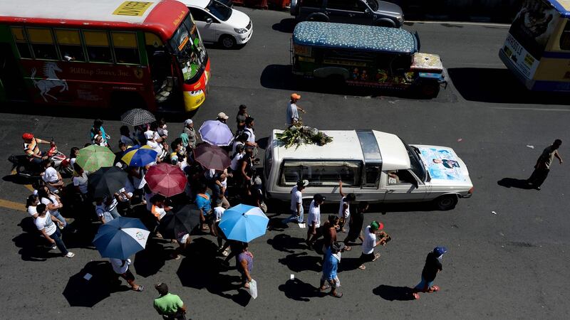 Relatives of Michael Siaron follow a hearse carrying his coffin during his funeral ceremony in Manila on Wednesday. Photograph: Noel Celis/AFP/Getty Images