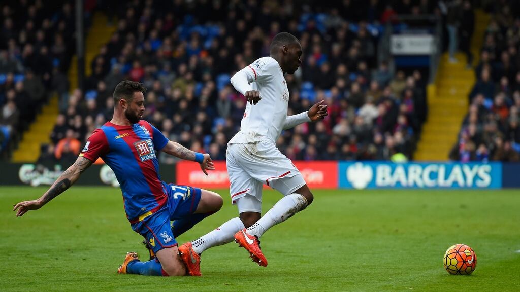 Damien Delaney of Crystal Palace fouls Christian Benteke of Liverpool to concede a penalty at Selhurst Park. Photograph: Mike Hewitt/Getty Images