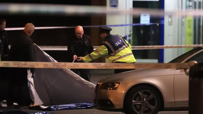 Gardaí at the scene of the fatal shooting. Photograph: Collins
