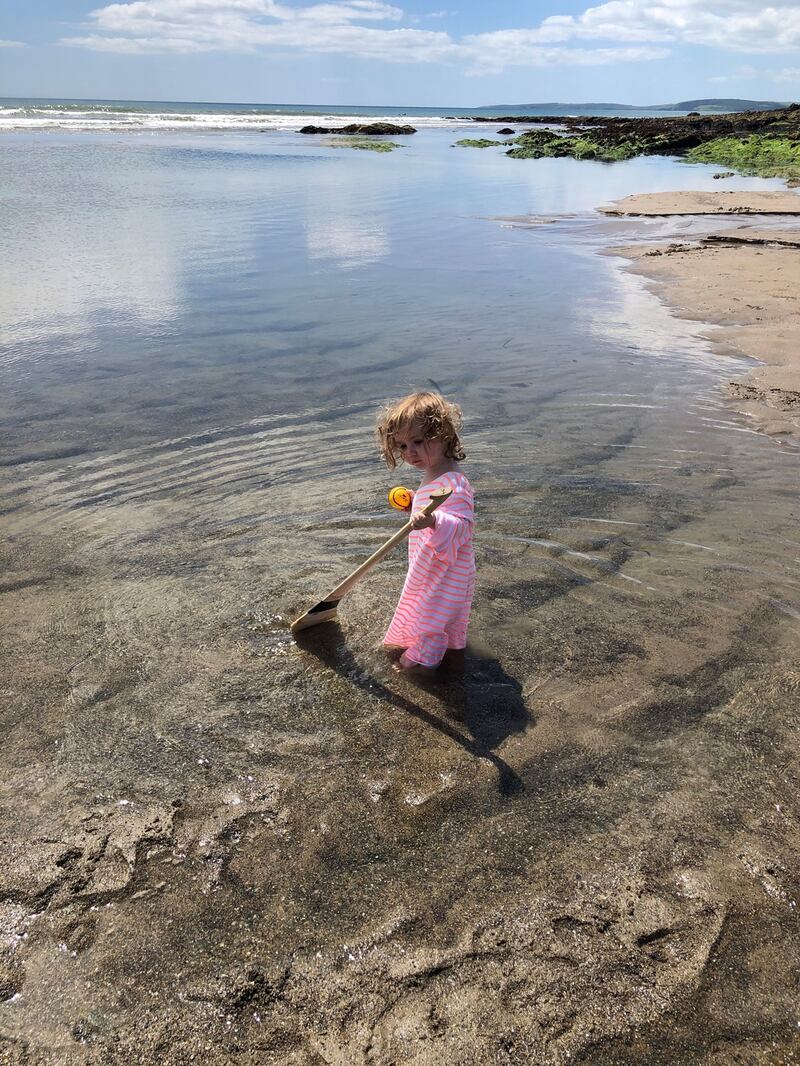 Ruby Harris Pope discovers hurling on Garrettstown Strand, Co Cork. Photograph: Conor Pope