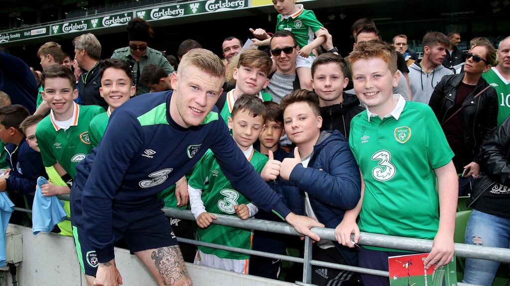 James McClean poses for a picture with fans after Ireland training at the Aviva Stadium. Photo: Tommy Dickson/Inpho