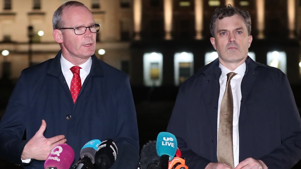 Tanáiste Simon Coveney (left) and Secretary of State for Northern Ireland Julian Smith, issue a statement outside Stormont Parliament buildings in Belfast on Thursday night. Photograph: Niall Carson/PA Wire