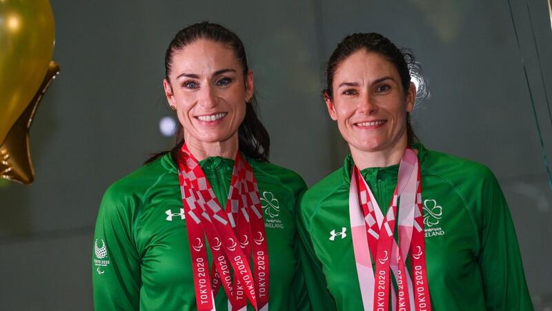Eve McCrystal (left) and Katie George Dunlevy, Women’s Tandem B 3000m Individual pursuit, silver, Women’s B tandem road race gold, women’s B time trial gold medalists, on their return from the Tokyo 2020 Paralympic Games. Photograph: Sportsfile