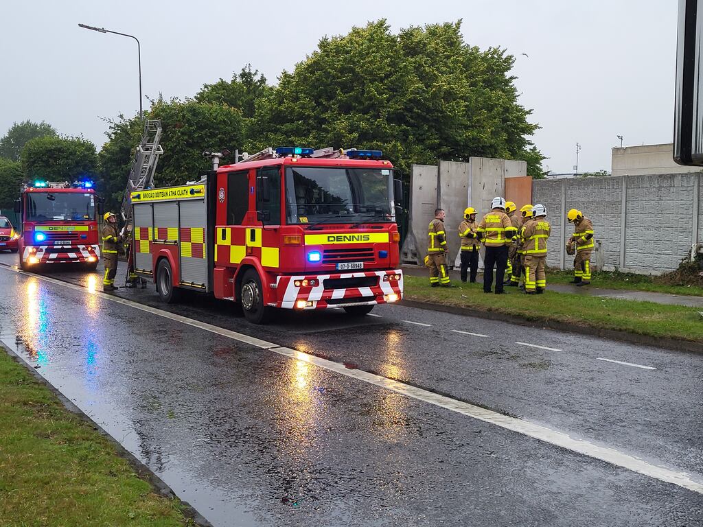 Two fire tenders and other emergency vehicles at the site of the former Crown Paints factory site on Malahide Road, Coolock, following a fire on Sunday evening