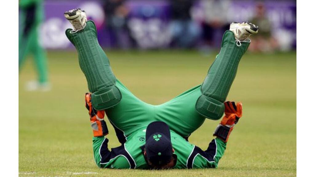 Ireland's Gary Wilson stretches ahead of their win against the Netherlands at Castle Avenue in Clontarf - (Photograph: Cathal Noonan/Inpho)