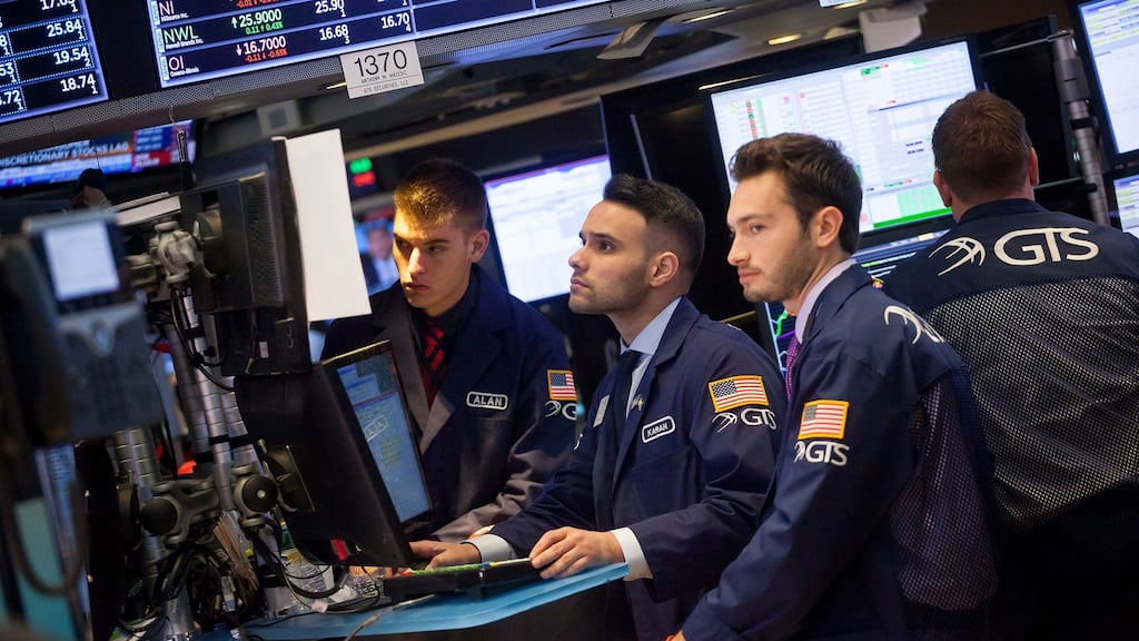 Traders work on the floor of the New York Stock Exchange.