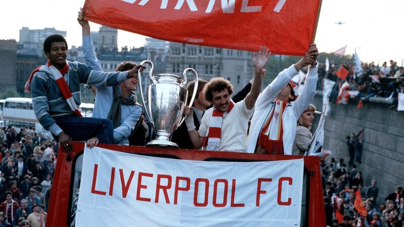 Howard Gayle holding the cup with Alan Kennedy as the victorious Liverpool team parade the European Cup on Merseyside after they had beaten Real Madrid 1-0 in Paris in 1981. Photograph: Bob Thomas/Popperfoto/Getty