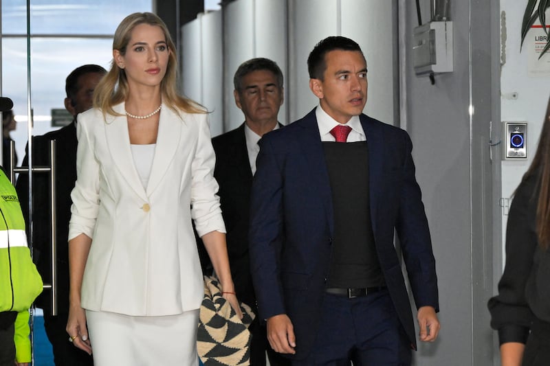 Ecuadorian presidential candidate Daniel Noboa, wearing a bulletproof vest, is accompanied by his wife Lavinia Valbonesi ahead of a presidential debate earlier this month. Photograph: Rodrigo Buendia/AFP via Getty Images