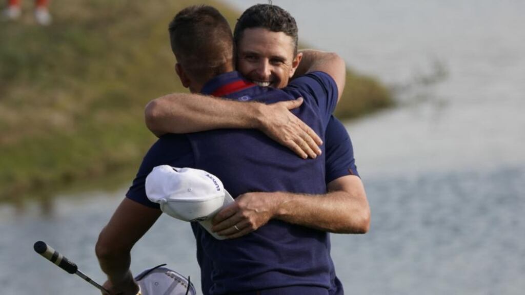 Europe’s English golfer Justin Rose (R) and Europe’s Swedish golfer Henrik Stenson celebrate their victory. Photograph: Getty Images