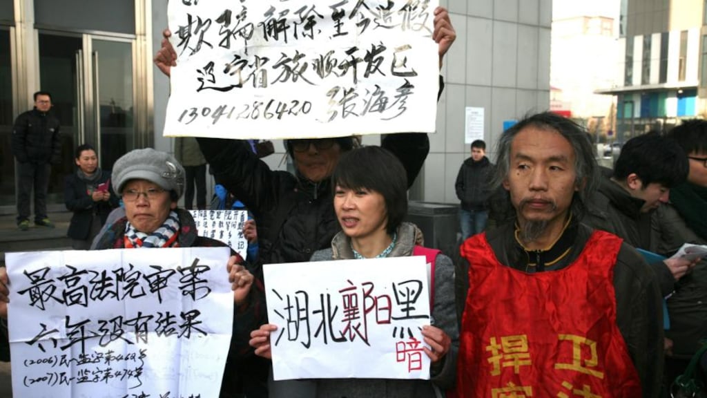 Supporters of Chinese human rights lawyer Xu Zhiyong outside the  Beijing No 1 Intermediate People’s Court in Beijing, China today. Photograph: EPA