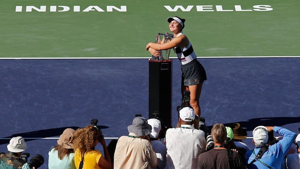 Bianca Andreescu of Canada hugs the trophy after beating Angelique Kerber of Germany in the final of the BNP Paribas Open at Indian Wells in California. Photograph: Larry W Smith/EPA