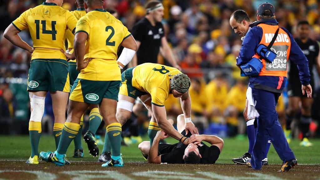 Australia’s  David Pocock  checks on the injured Ryan Crotty of New Zealand  during the Rugby Championship  match at  at ANZ Stadium  in Sydney. Photograph: Mark Kolbe/Getty Images