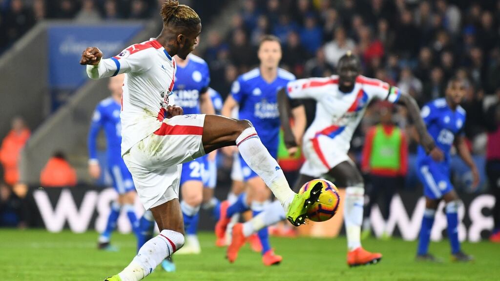 Wilfried Zaha scores Crystal Palace’s second goal during the Premier League match against Leicester City at The King Power stadium. Photograph: Clive Mason/Getty Images