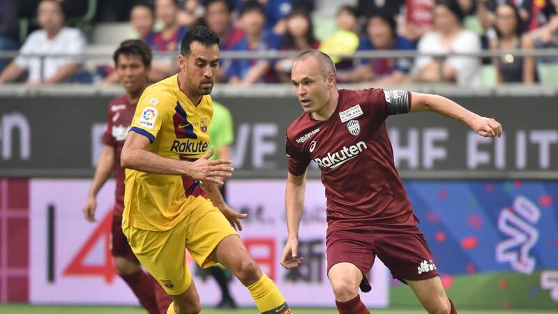 Vissel Kobe’s Andres Iniesta in action against former team-mate Sergio Busquets. Photograph: Kazuhiro Nogi/Getty