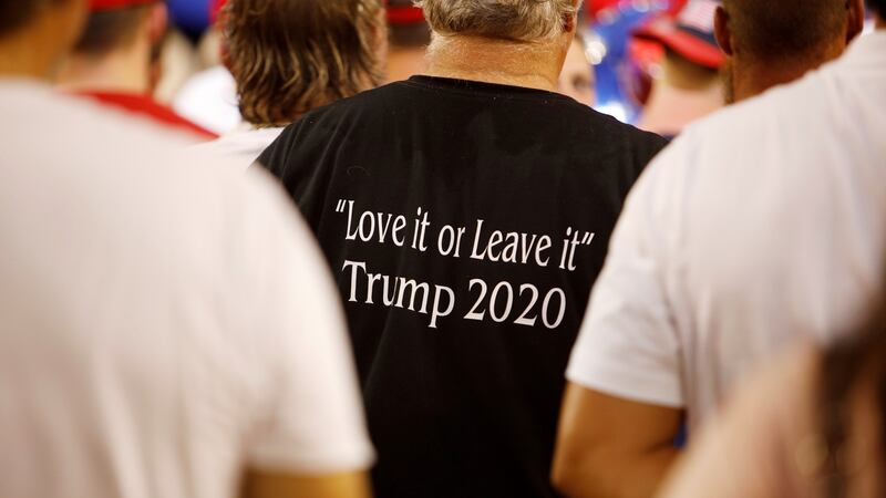 A supporter of US president Donald Trump wears a shirt with the message of ‘Love It or Leave It’ at a ‘Keep America Great’ campaign rally in Greenville, North Carolina. Photograph: Reuters/Jonathan Drake
