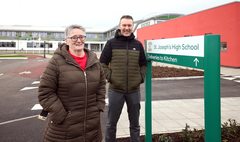 Úna Walsh and Oisín McConville outside the new secondary school in Crossmaglen. Photograph: Stephen Davison