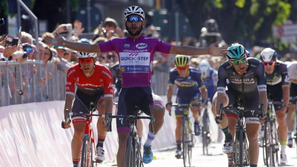 Colombian Fernando Gaviria crossing the line to win ahead of Ireland’s Sam Bennett (right) in the 13th stage of the Giro d’Italia from Reggio Emilia to Tortona. Photograph: AFP