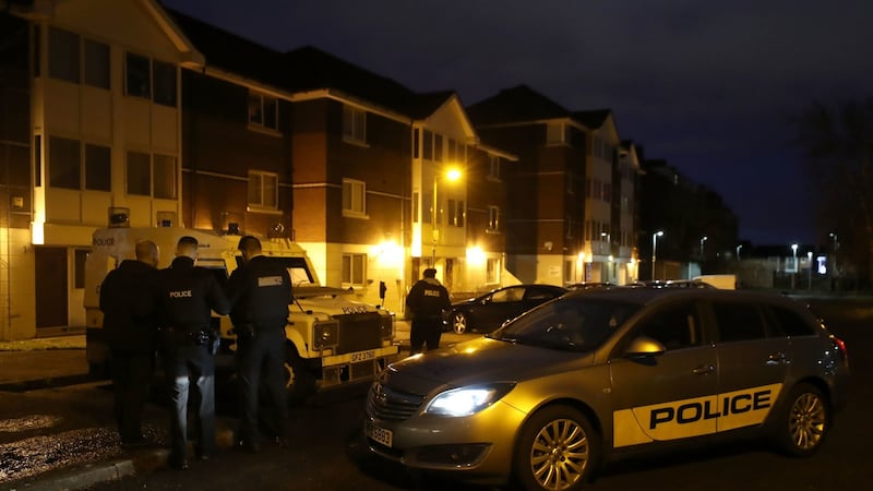 Police officers at the scene on Kinnaird Close in Belfast after the bodies of a man and a woman were found in an apartment this afternoon. Photograph: Liam McBurney/PA Wire