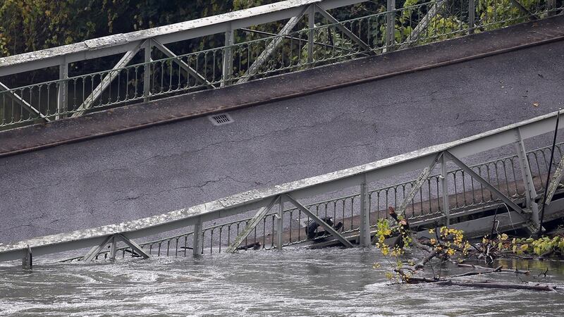 View of a suspension bridge collapsed in the Tarn river in Mirepoix-sur-Tarn, near Toulouse, southern France. Photograph: Frederic Scheiber/EPA