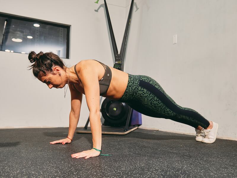 The push-up requires keeping the body rigid in a straight line, with face forward, then lowering the body until just before the nose touches the floor. Photograph: Zack DeZon/The New York Times