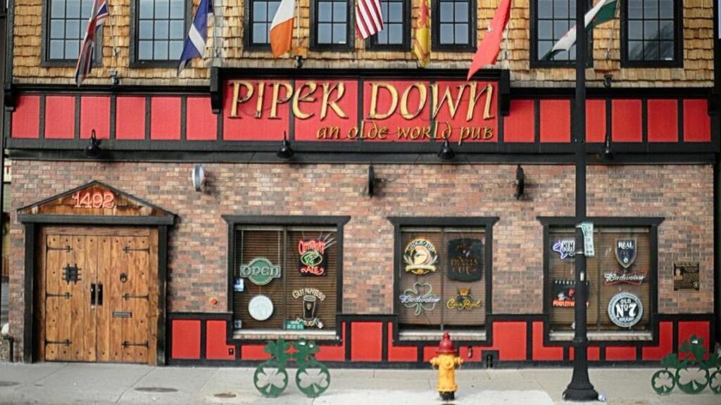 Outside the Piper Down pub are bike racks shaped like shamrocks.