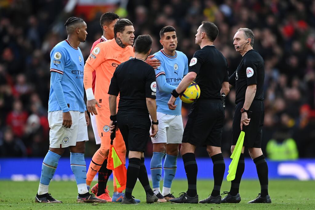 Manuel Akanji, Ederson and Joao Cancelo of Manchester City argue with referee Stuart Attwell following the Premier League match against Manchester United at Old Trafford. Photograph: Michael Regan/Getty Images