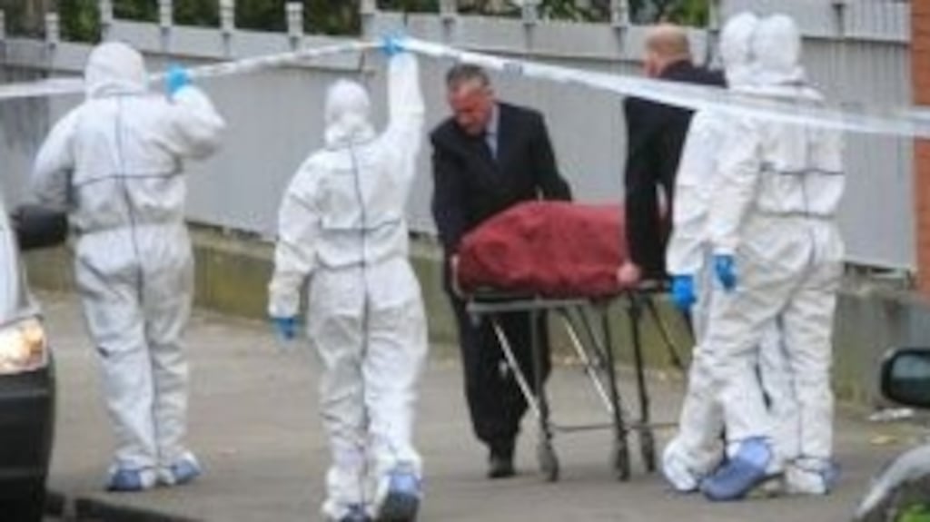 The body of Kieran Farrelly is removed from the scene of his murder at Killarney Court flats off Buckingham Street, Dublin. Photograph: Gareth Chaney/Collins