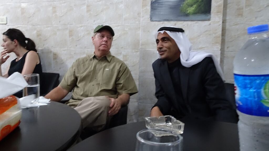 US Republican senator Lindsey Graham dines at the Palace of Princes restaurant in Manbij, Syria, in July 2018. Photograph: Charlie Savage/New York Times