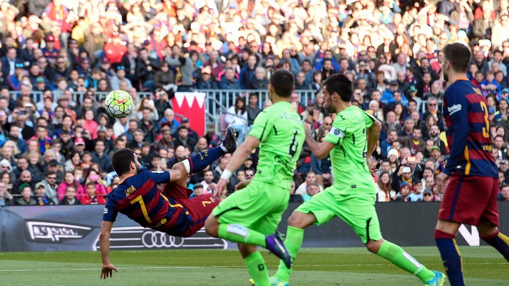 Barcelona’s Turkish midfielder Arda Turan scores his side’s sixth goal with an overhead kick in the Primera Division match against Getafe at the Nou Camp. Photograph: Josep Lago/AFP/Getty Images