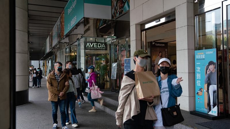 People wearing personal protective equipment shop in downtown Taipei, Taiwan. Photograph: Ashley Pon/The New York Times