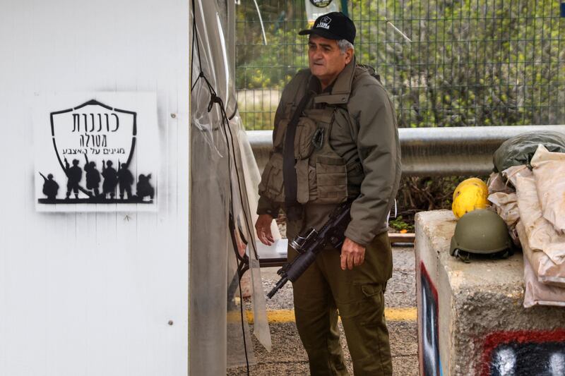 A security man standing at the entrance of the deserted northern Israeli town of Metula, near the border with Lebanon. Photograph: Jalaa Marey/AFP via Getty Images
