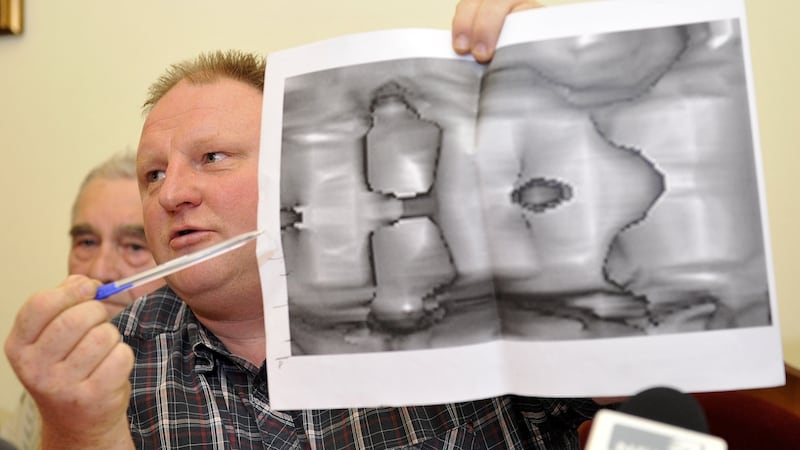 Explorer Piotr Koper points on a ground-penetrating radar image which represents, according to him, a second World War Nazi train during a press conference on September 18th near Walbrzych, Poland. Photograph: Piotr Hawalej/AFP/Getty Images