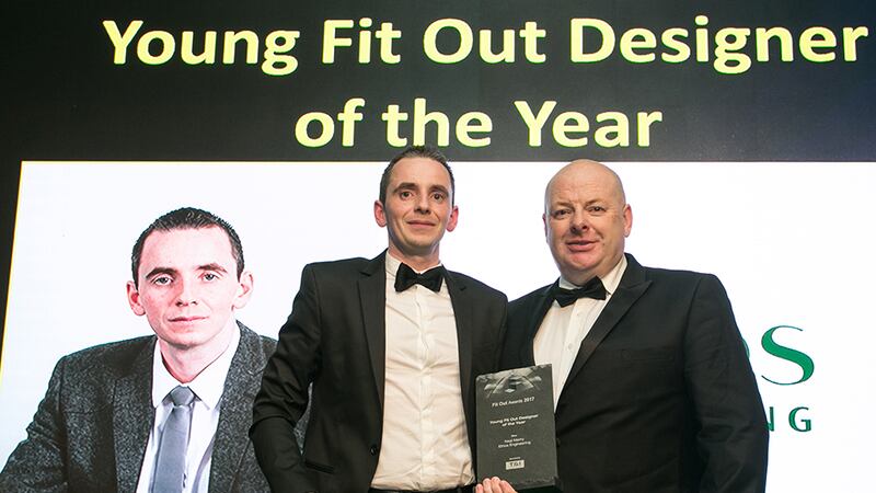 Ben Lambe, Director, T&I Fitouts presents the Young Fit Out Designer of the Year award to Neal Merry, Ethos Engineering