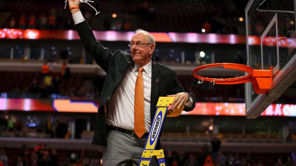 Syracuse Orange head coach Jim Boeheim waves to the crowd after cutting down the net after defeating the Virginia Cavaliers in the championship game of the midwest regional of the NCAA Tournament at the United Center. Photograph: Dennis Wierzbicki/Usa Today Sports