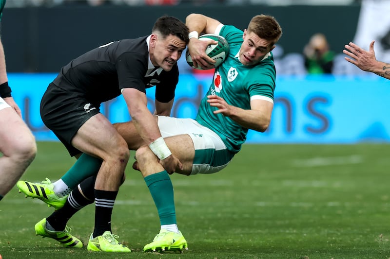 New Zealand's Will Jordan tackles Ireland's Jack Crowley. Photograph: Gary Carr/Inpho