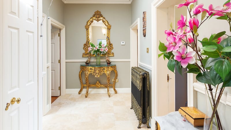 Hallway with cast-iron radiator and skylight