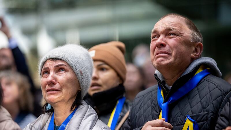 Ivan and Maria Matvichuk, who arrived from Nikolaev, Ukraine, last Saturday, in tears as the Ukrainian flag is raised at Fingal County Hall, Swords, Dublin. Photograph: Tom Honan