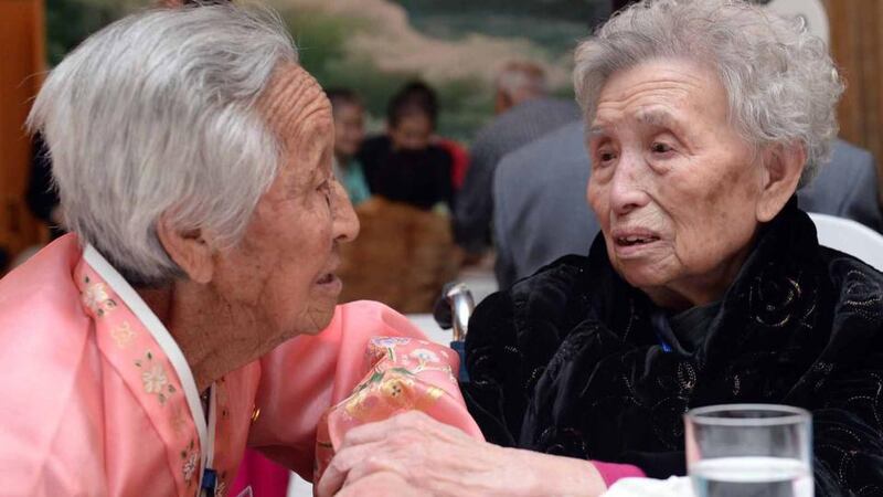 South Korean Lee Young-Shil (right),88, meets with her North Korean sister Lee Jung-Shil during a family reunion after being separated for 60 years. Photograph:  Kim Ju-Sung-Pool/Getty Images