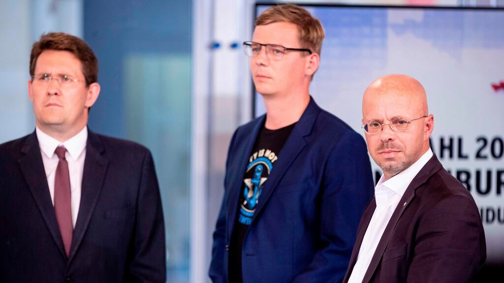 Brandenburg candidates for the Freie Waehler party Peter Vida, the Greens’ Benjamin Raschke and the far-right AfD party’s Andreas Kalbitz. Photograph: Christoph Soeder