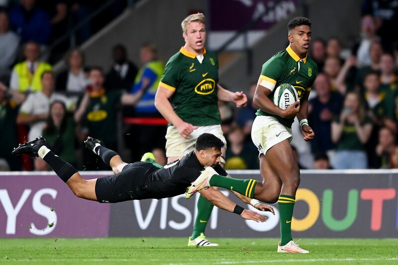 Canan Moodie runs away from a despairing All Black during South's record win at Twickenham on Friday. Photograph: Alex Davidson/Getty Images